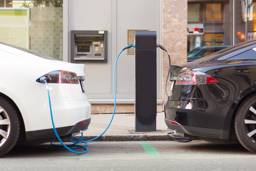 Electric Cars Plugged into Charging Station